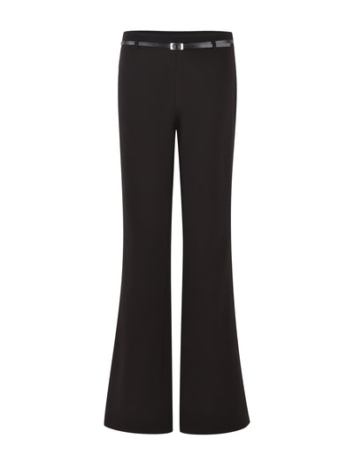 Introducing the TERLA PANT - BLACK by TIGERMIST. This pair of suiting pants features a mid-rise waist and a sleek design. Crafted from smooth fabric, they showcase a tailored finish with a small metallic buckle adding subtle detail to the waistband. The legs widen slightly from the knee downwards, creating an elegant flared silhouette.