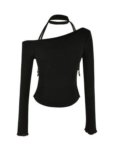 The MIETTA TOP - BLACK by TIGERMIST is a black, long-sleeve top with an asymmetric shoulder design, featuring a multi-tie neck and single strap extending from the left neckline to the right shoulder. It has a fitted silhouette with a slightly flared hem, made from high stretch fabric for ultimate comfort and style.