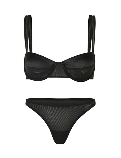 The TIGERMIST SAFFRON SET 2.0 - BLACK is a bikini set showcased against a white backdrop. The top boasts a balconette shape with underwire cups and double shoulder straps, perfectly complementing the mid-rise bottoms crafted from semi-sheer material. This design effortlessly achieves a sleek and sensual look.