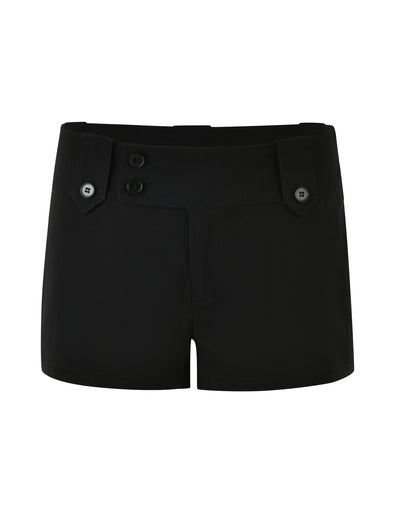 Introducing the KITTIE SHORT - BLACK by TIGERMIST, these black high-waisted shorts feature a flat front design inspired by our best-selling Kittie pant. The shorts include two buttoned tab closures on the waistband and two buttons on each side for added detail. Crafted from a smooth, tailored fabric with a hint of high stretch for ultimate comfort.