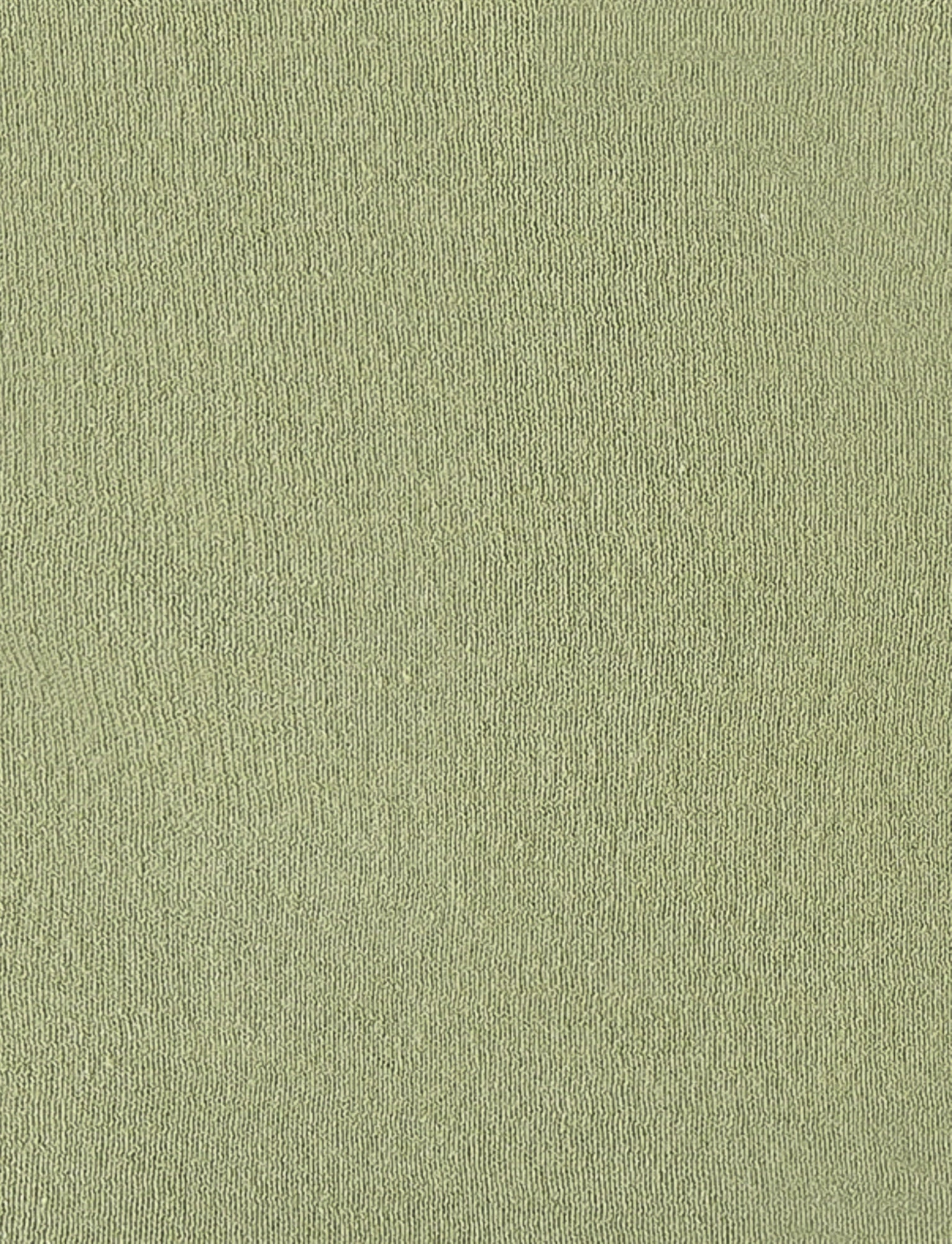 Here's a close-up image of the textured fabric surface of the DIEDRE JUMPER - GREEN by TIGERMIST. The high-stretch fabric features a consistent knit pattern and a tight weave. Its soft pastel green color lends a calm and soothing appearance, making it an ideal choice for this stylish jumper dress.