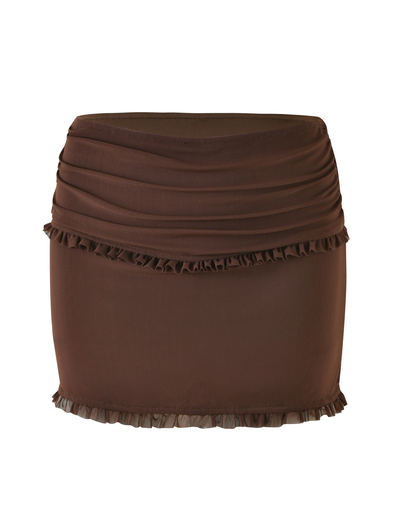 The TIGERMIST GINNY SKORT - BROWN : CHOCOLATE is a brown mini skort with a fitted bodycon silhouette, ruched top detailing, and ruffle trim along the hem and upper section.