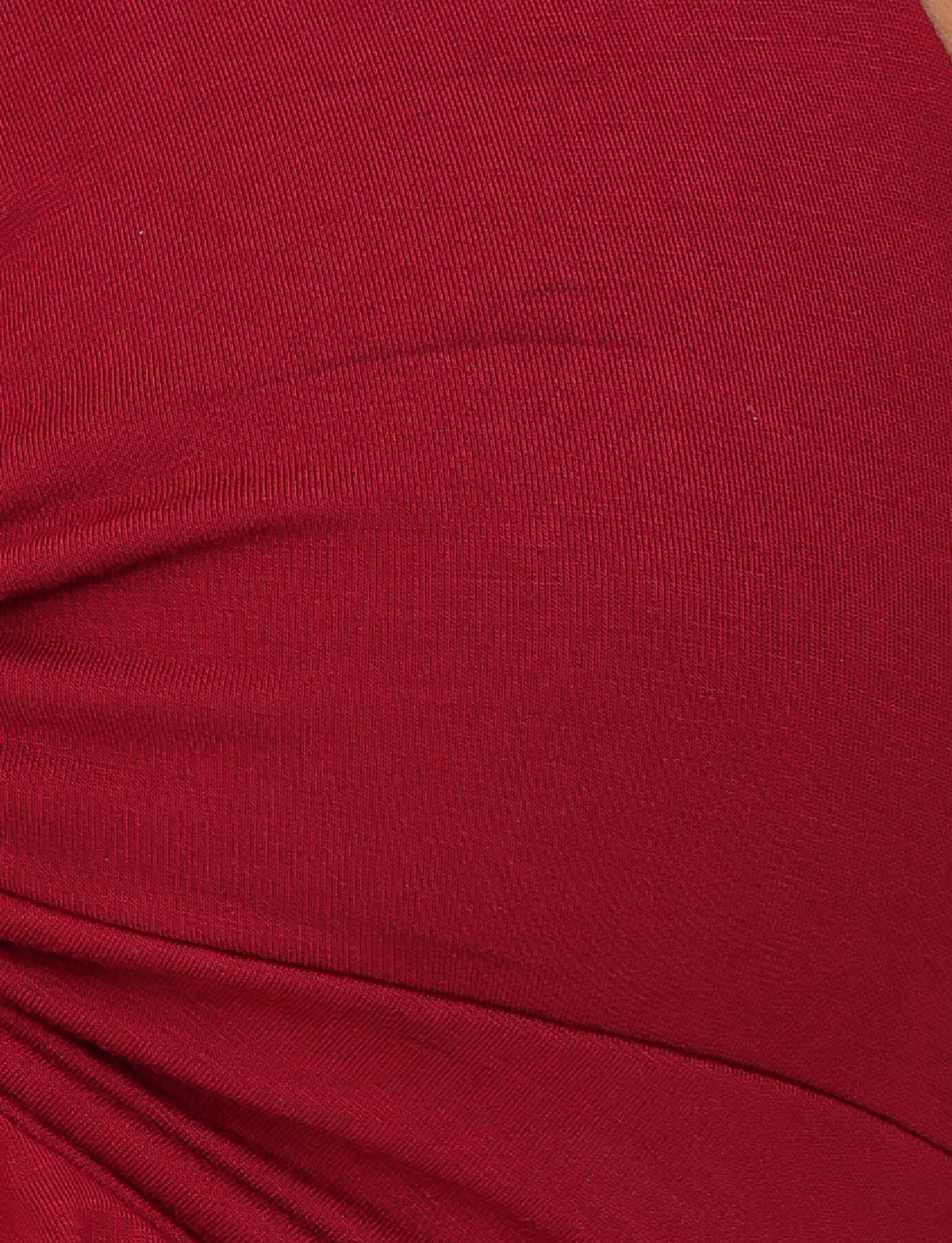 Close-up of the TIGERMIST KATYA HALTER TOP in red, highlighting its visible seam and ruched details that create textured folds.