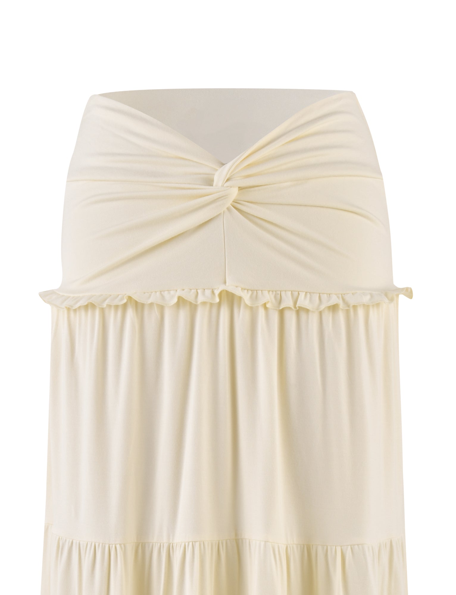 The TIGERMIST KATYA MAXI SKIRT in cream features a strapless design with a twisted knot at the top and tiered panels creating a ruffled seam below. The smooth, buttery jersey fabric is displayed against a plain white background.