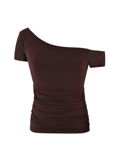 The LEILANI TOP in chocolate brown by TIGERMIST is a sophisticated, fitted piece with an asymmetrical neckline, showcasing a one-shoulder design crafted from buttery jersey and enhanced with ruched detailing on the side.
