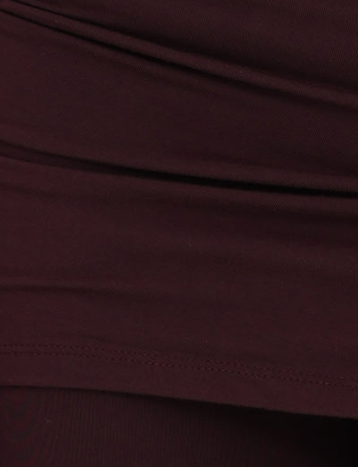 A detailed view of the LEILANI PANT - BROWN : CHOCOLATE from TIGERMIST highlights the visible stitching and folds, indicative of apparel. The fabric has a smooth texture with a bit of elasticity, suggesting it's made from high-stretch material ideal for comfort and fit.