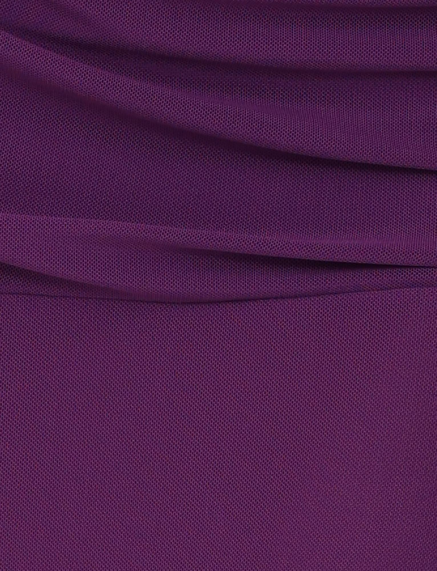 Close-up of the TIGERMIST MARIANA SKIRT - PURPLE fabric, showing its deep purple hue and fine textured weave, with soft horizontal folds near the top—a signature detail of its asymmetric wrap design.