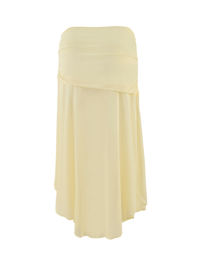 The TIGERMIST MARIANA SKIRT in pale yellow features a strapless, flowy mesh fabric with a layered, asymmetrical hemline, displayed on a plain white background.