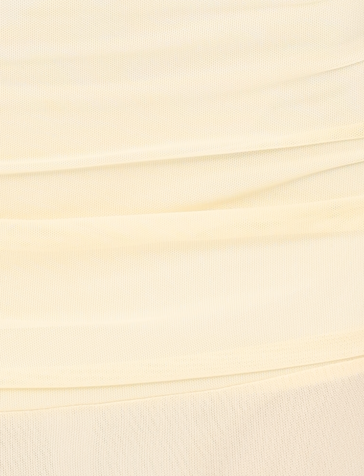 Close-up of the TIGERMIST MARIANA SKIRT in pale yellow, featuring soft mesh fabric with horizontal gathered folds and a textured surface—lightweight and perfect for an airy midi style with subtle shading and lines.