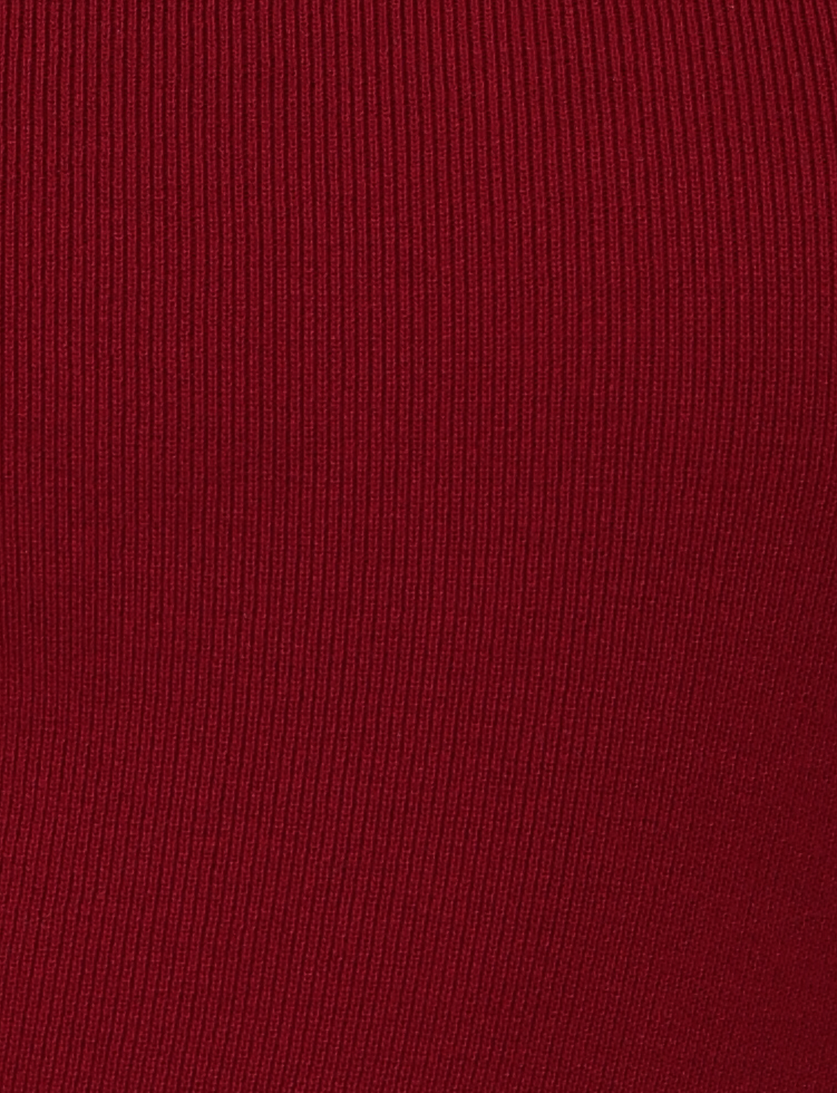 Close-up of red ribbed fabric in the "Wine" colourway, highlighting vertical texture lines from TIGERMIST’s CYPRESS MINI DRESS – RED : WINE.