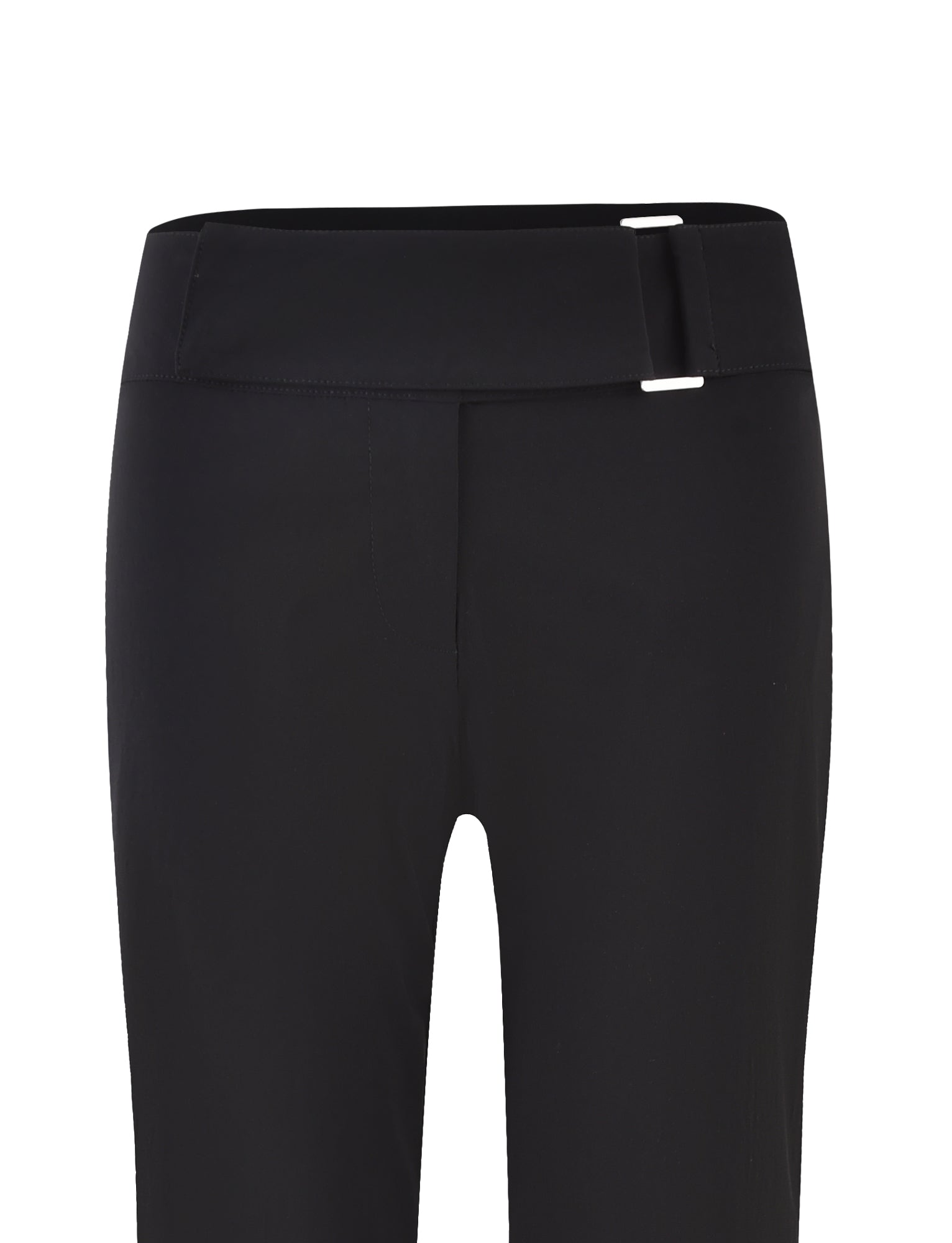 Close-up of the VESPER PANT - BLACK by TIGERMIST featuring a flat front design and a decorative silver buckle at the low-rise waistband. The fitted silhouette showcases the smooth, high-quality, slightly stretchy material.