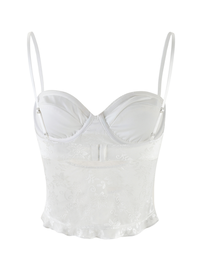 The CHARLEIGH TOP - WHITE : LACE by TIGERMIST is a white satin and lace crop top with adjustable straps, underwire cups, floral lace detailing, and a flared hem for an elegant, delicate look.