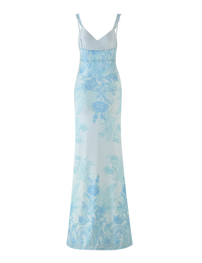 Crafted from light blue high stretch fabric, the GUILIANNA FRILL MAXI DRESS - BLUE : FLORAL : TAPESTRY by TIGERMIST showcases an elegant floral pattern in various shades of blue. The design is completed with adjustable frill shoulder straps, providing both style and comfort for any occasion.