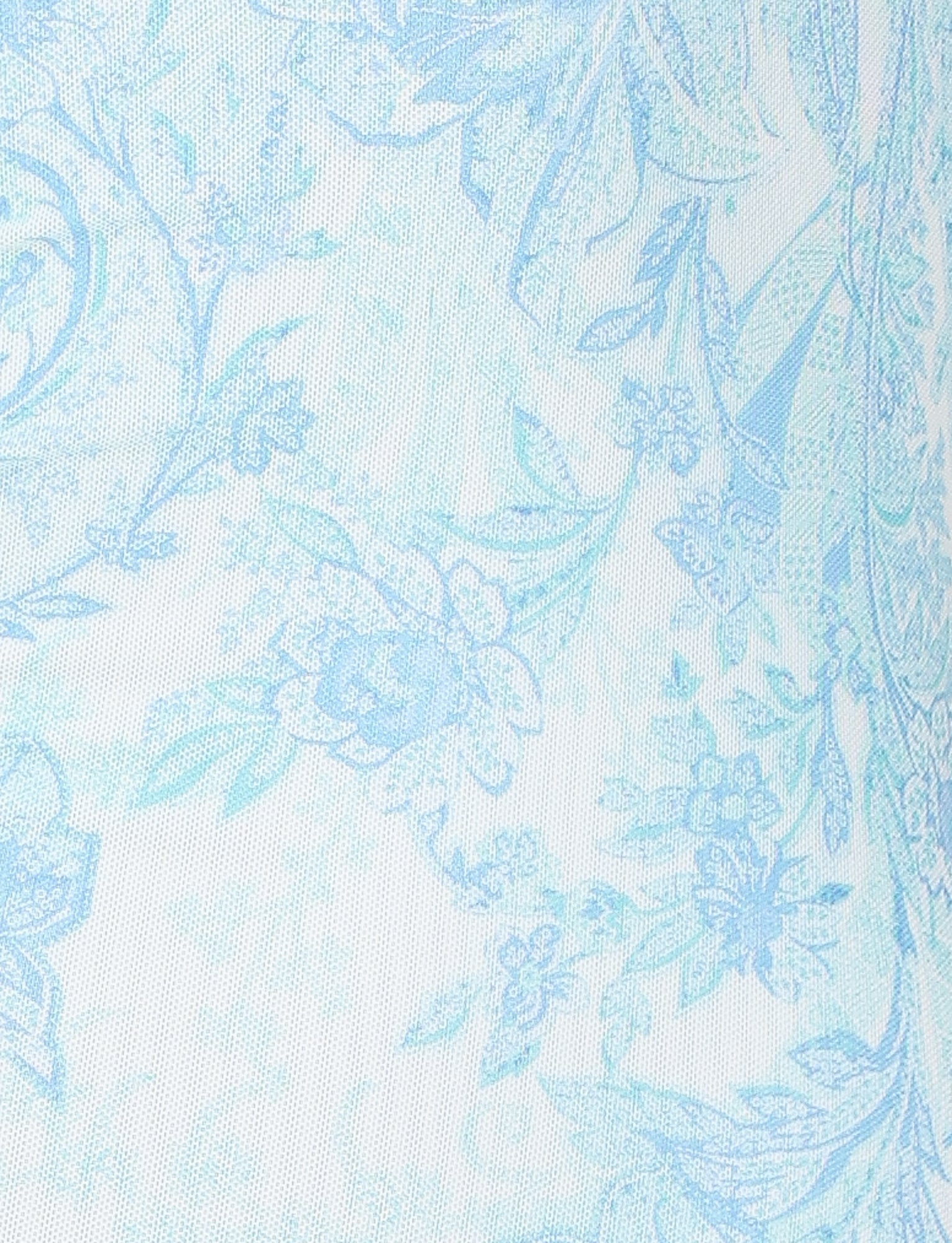 The GUILIANNA FRILL MAXI DRESS by TIGERMIST showcases a tapestry of light blue floral patterns, with its textured fabric adorned with intricate flower and leaf designs. The softly colored print provides an elegant visual appeal, further enhanced by an adjustable frill shoulder strap for added allure.