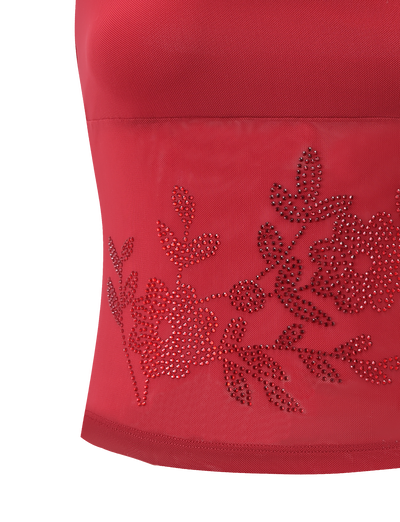 A close-up of the TIGERMIST OCTAVIA TOP - RED, showcasing its sheer mesh panel decorated with rhinestone floral and leaf designs.