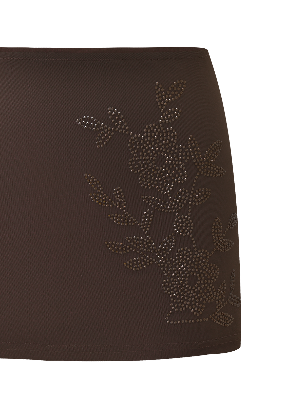 Close-up of the TIGERMIST OCTAVIA MINI SKIRT - CHOCOLATE SPARKLE, featuring dark brown fabric with floral embellishments of small, shiny studs—ideal for adding luxe detail to your look.