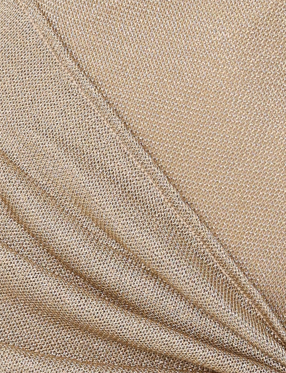 Close-up of shimmering gold metallic knit fabric with a fine, textured weave and soft folds—perfect for creating the elegant TIGERMIST AZELMA MAXI DRESS - GOLD.