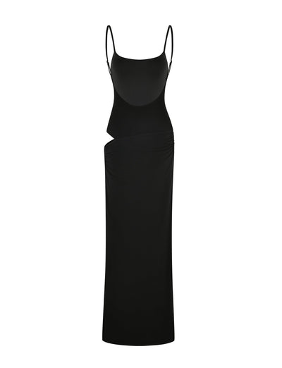 The TIGERMIST UMA DRESS - BLACK is a long, fitted black maxi dress featuring adjustable spaghetti straps and an asymmetrical waist cut-out, shown on a white background.