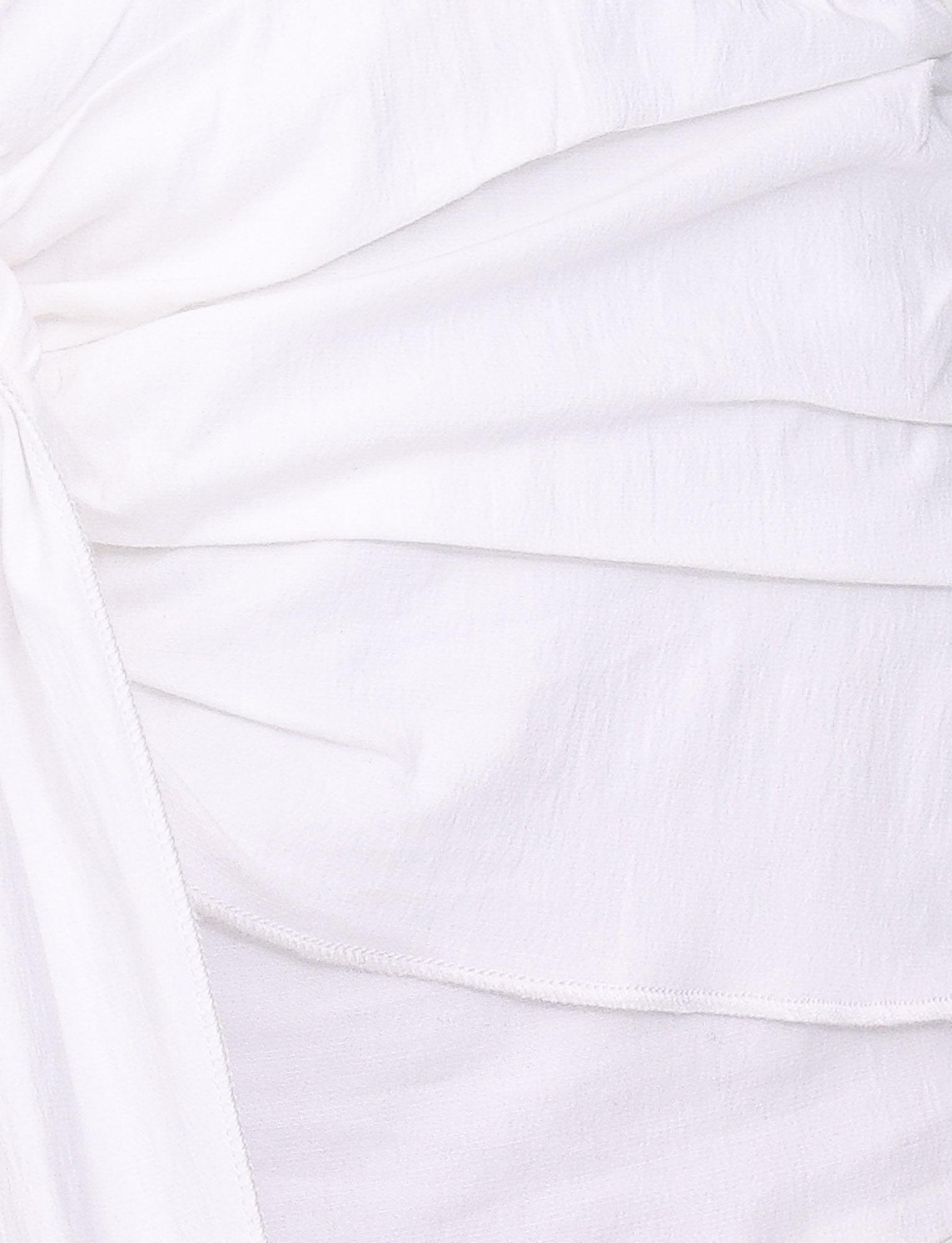 Close-up of cotton poplin fabric with soft, gathered folds and visible stitching on the TIGERMIST ZADIE SHIRT DRESS - WHITE, creating a textured, layered look inspired by classic fitted shirt dresses.