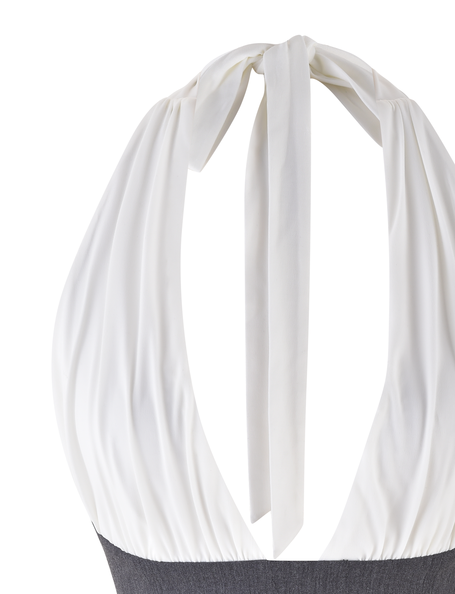 A close-up of the TIGERMIST LOTUS TOP - CREAM : GREY, featuring a large bow at the neck with draped fabric down the back, paired with a dark gray bottom.