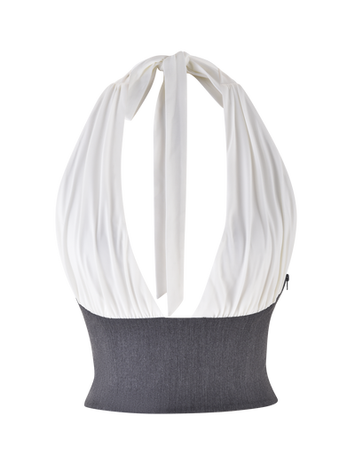 The TIGERMIST LOTUS TOP - CREAM : GREY is a cropped halter with a white gathered neckline that ties at the back, a fitted dark grey ribbed bottom with a stretch suiting waist panel, and an elegant open back that highlights the upper back.