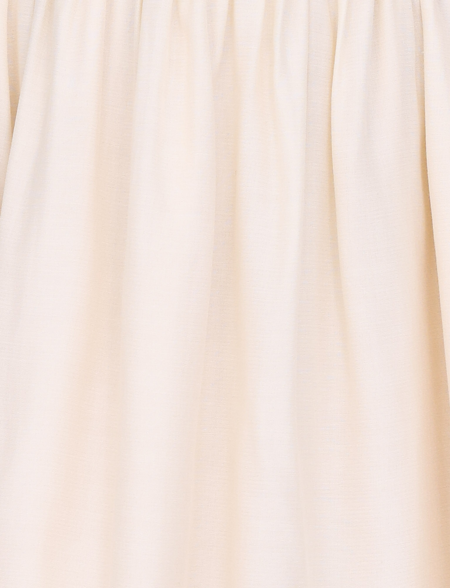 Close-up of the TIGERMIST CALISTA MINI DRESS in Butter Yellow shows light beige fabric with gathered, pleated details at the top, soft folds, a fitted waist panel, and a gently wrinkled texture.