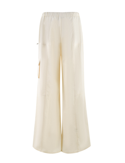 The TIGERMIST HERMIONE PANT in yellow soft butter features a wide-leg, high-waisted design with an elastic waistband and side pocket, shown on a white background.