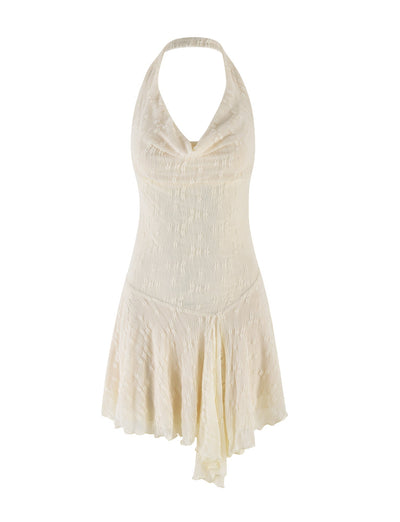 The FIORELLA MINI DRESS by TIGERMIST features a sleeveless cream lace design with a halter neck, draped cowl neckline, fitted bodice, and asymmetrical flowy skirt, finished with a subtle textured pattern for an elegant touch.