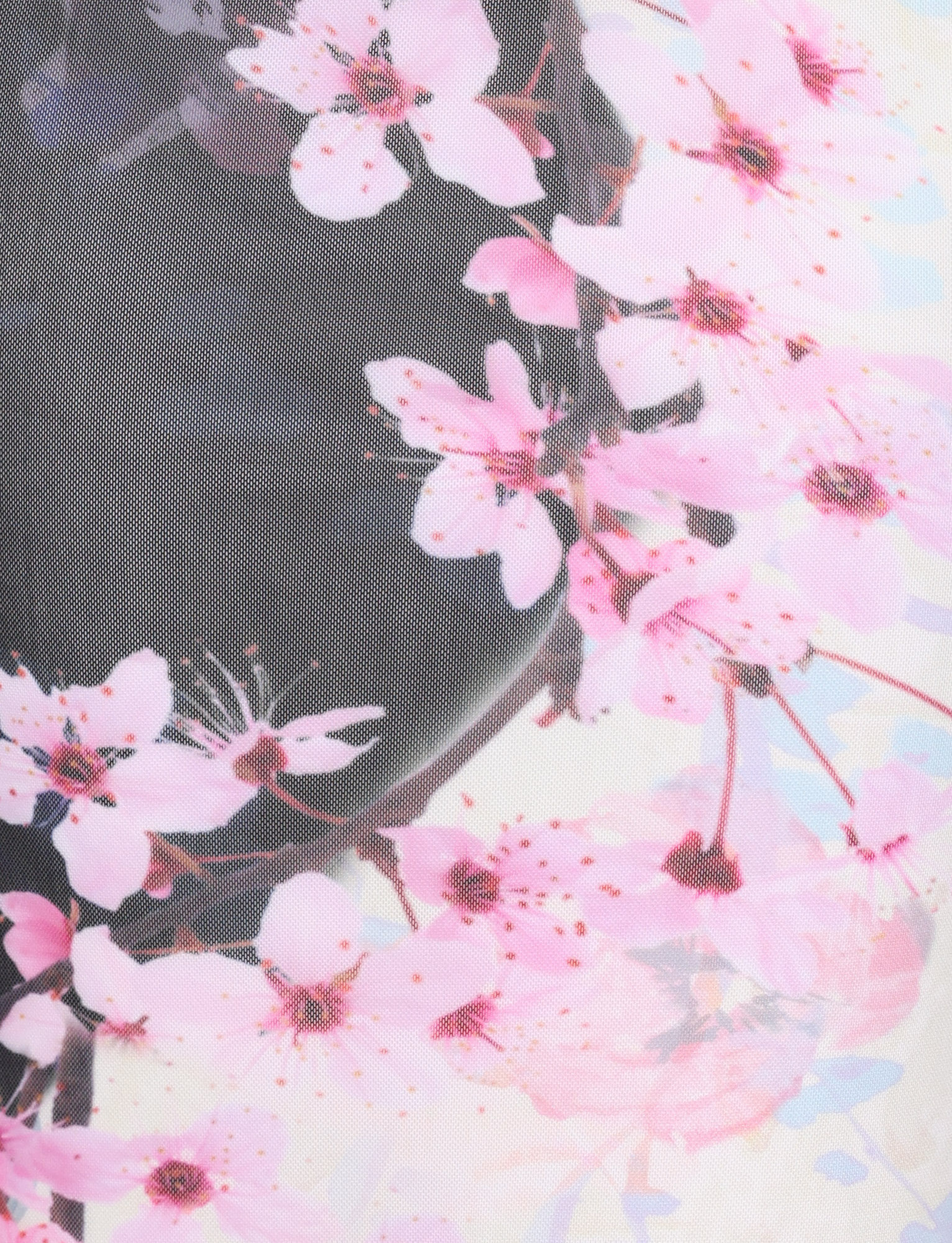 Close-up of pink cherry blossom florals on sheer black mesh fabric from the TIGERMIST LILLIAN MAXI DRESS - MULTI : FLORAL : CHERRY BLOSSUM, creating a delicate and soft pattern for this strapless maxi dress.