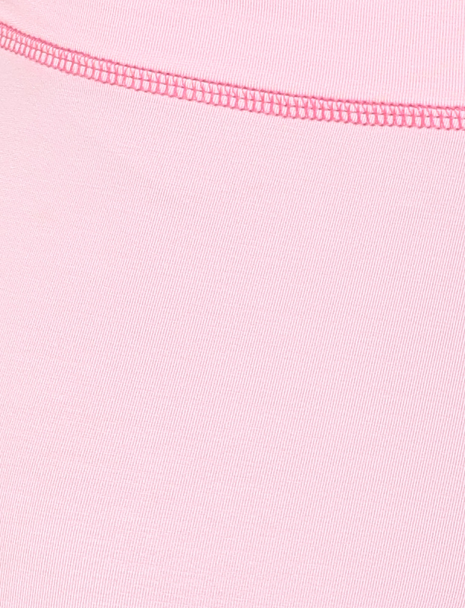 Close-up of the TIGERMIST BLAYZE PANT in Soft Pink shows the fabric’s texture, a visible seam, and neat pink stitching along the top edge.