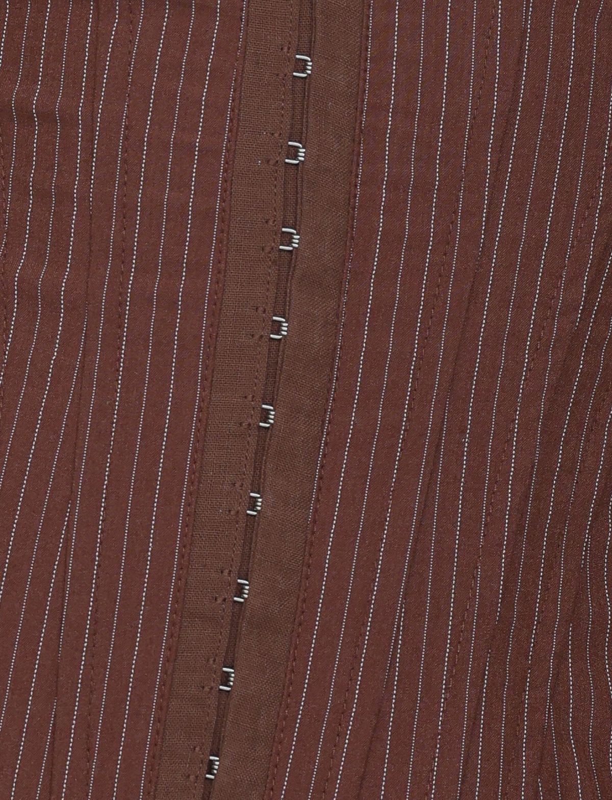 Close-up of the TIGERMIST ANTONELLA CORSET 2.0 in Chocolate Pinstripe, featuring chocolate brown suiting fabric with thin white pinstripes and silver hook-and-eye closures down the center.