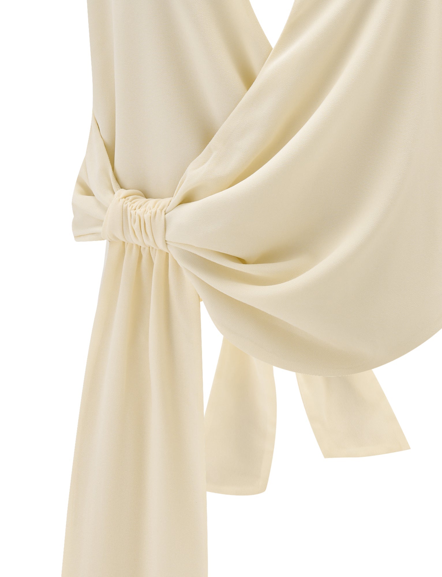 Close-up of the INDIGO TOP - IVORY by TIGERMIST, featuring a satin-like finish, halter neck, draped and ruched waist detail with a loose knot, and an adjustable tie waist for a perfect fit. Elegant formalwear in smooth ivory fabric.