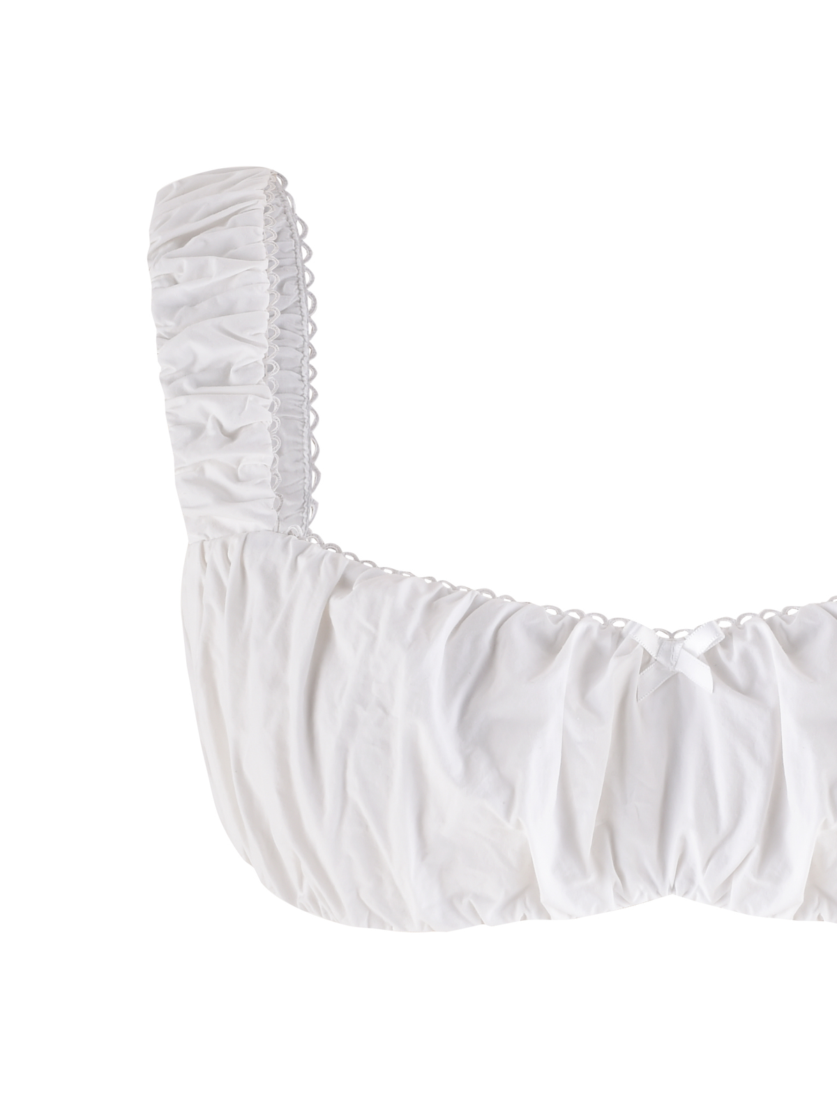 The SABRA TOP - WHITE by TIGERMIST is a cotton cropped top with ruched fabric, wide gathered straps, and a small bow at the neckline, shown on a plain white background.
