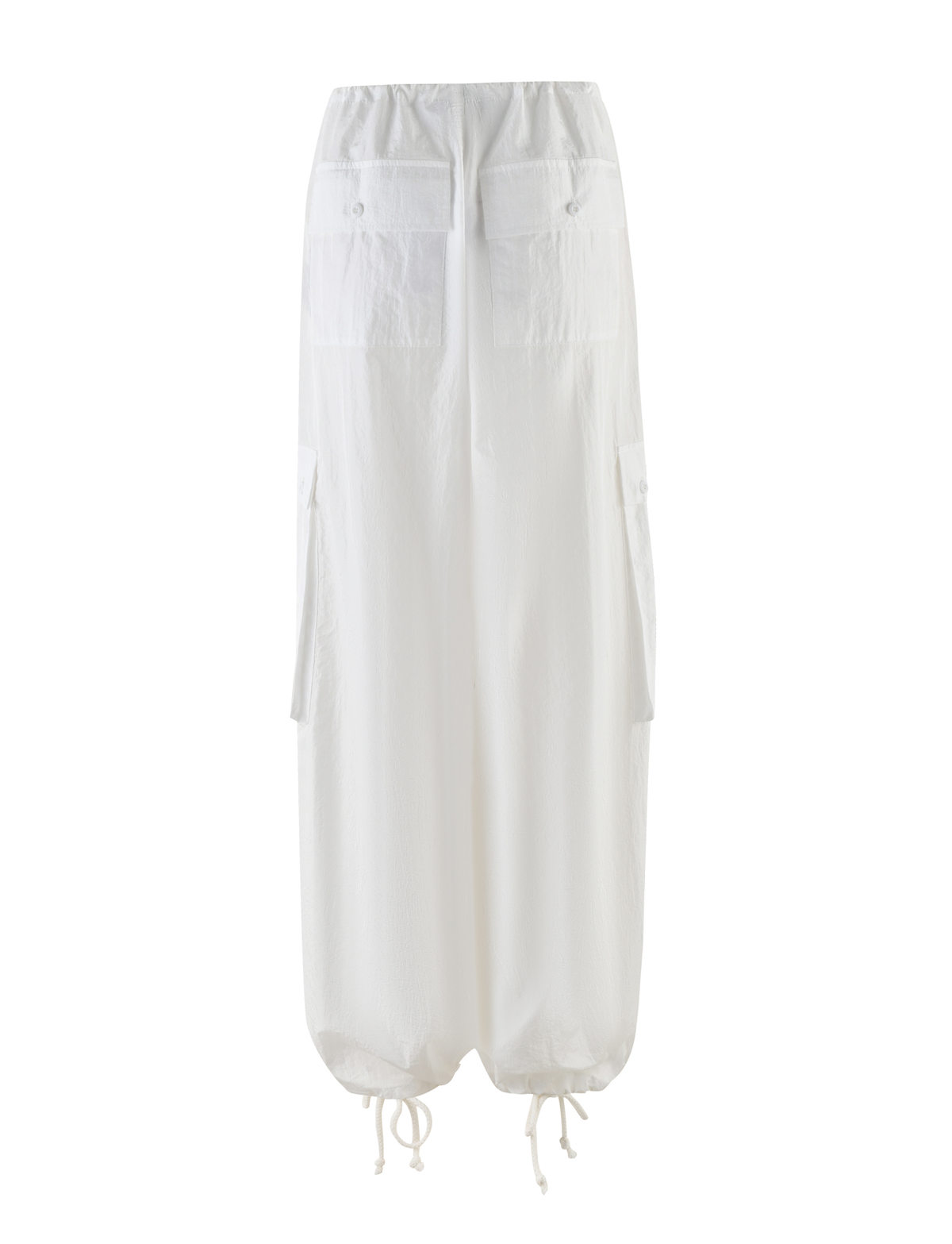 The VIOLETTE PANT by TIGERMIST in white features an elastic waistband, large front pockets with button flaps, side pockets, and adjustable hem drawstrings. Inspired by cargo pants, its lightweight fabric offers an oversized fit.