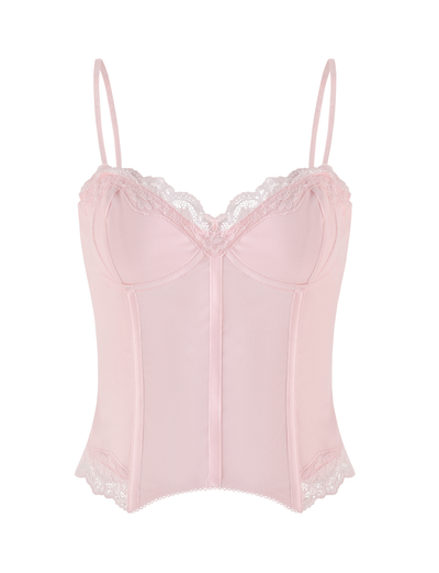 The TIGERMIST NILA CORSET TOP in Soft Pink is a lightweight jersey camisole with thin adjustable straps, delicate lace trim at the bust and hem, vertical front seams, and a slightly ribbed texture.