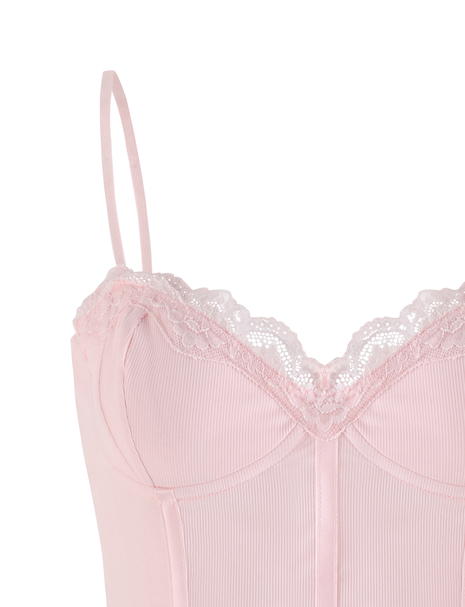 A close-up of the TIGERMIST NILA CORSET TOP in soft pink, featuring adjustable straps, lace-trimmed neckline, and subtle vertical ribbing on lightweight jersey fabric.