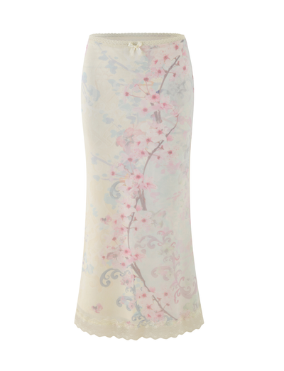 The TIGERMIST LONIE MIDI SKIRT in Neutral features a washed cherry blossom floral print, lace trim at the waist and hem, and a delicate bow at the waistband.