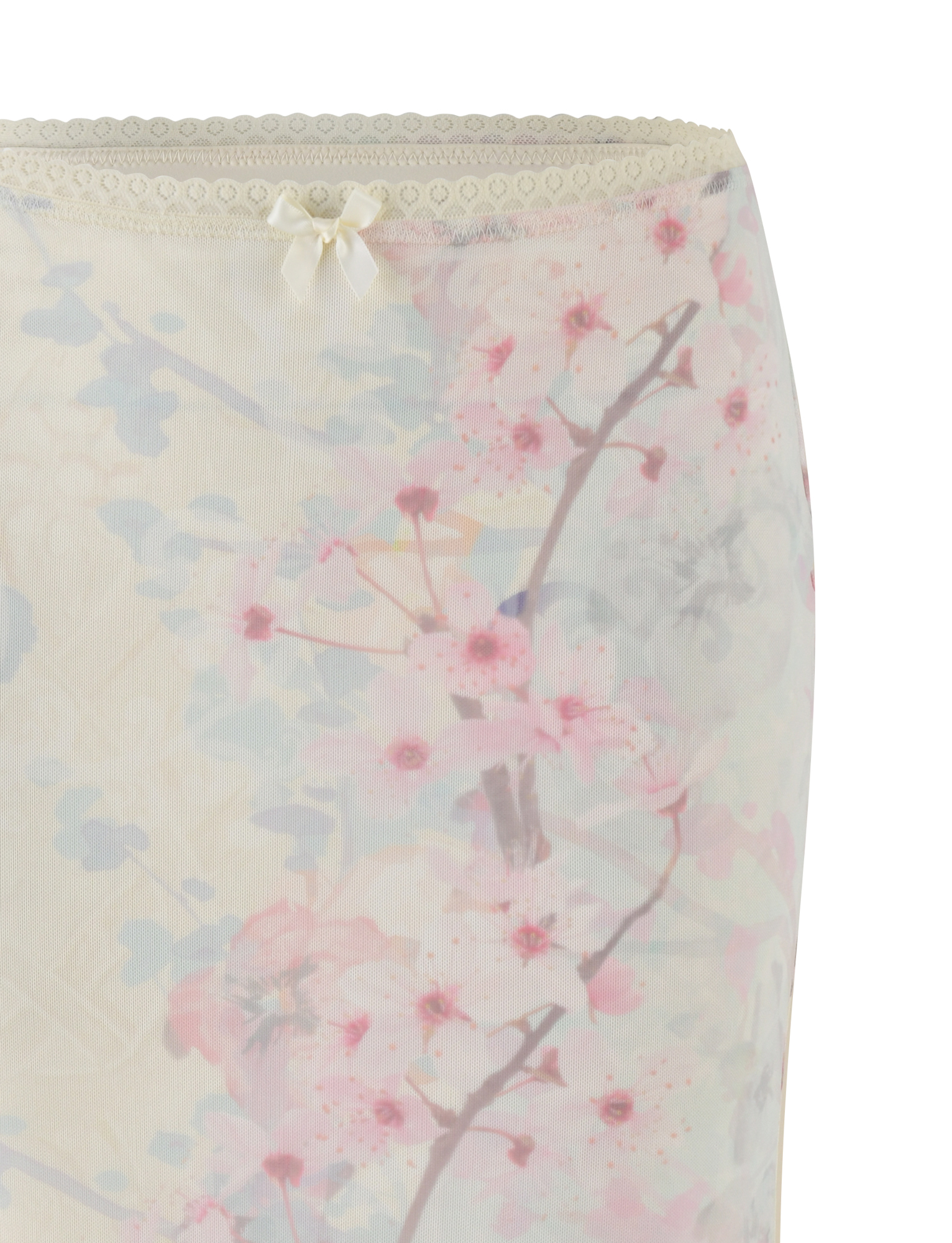 Close-up of the TIGERMIST LONIE MIDI SKIRT in Neutral, showcasing a washed cherry blossom floral print with lace trim and a satin bow—an exclusive design that pops against the white background.