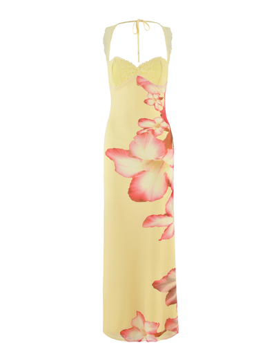 The TIGERMIST NYOMI MAXI DRESS in Yellow features a macro yellow hibiscus floral print, a lace bust panel, halter neck, and striking pink flowers flowing down one side.
