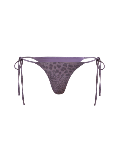 The TIGERMIST JESSALYN BIKINI BOTTOM - PURPLE TIGER features an animal print jersey design with cheeky minimal coverage and adjustable side ties, shown on a plain background.