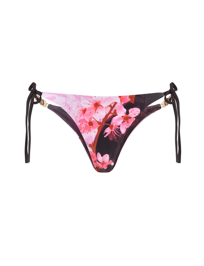 The JOVANNA BIKINI BOTTOM by TIGERMIST features a cheeky bikini cut with side ties and an exclusive animal floral border print in a bold multi-color design.