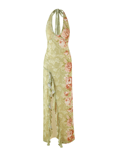 The TIGERMIST SIRENA MAXI DRESS is a long, sleeveless yellow halter neck dress with a rose stripe floral print, open back, ruffled high slit, and deep neckline.