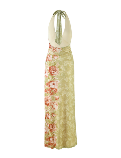 The TIGERMIST SIRENA MAXI DRESS is a sleeveless yellow dress with a floral rose stripe print, halter neck, deep V open back, and features large pink roses on the left and subtle leafy designs on the right.