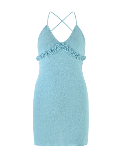 The TIGERMIST LAVELLE MINI DRESS - BLUE is a light blue, sleeveless bodycon mini with a deep V-neck, crisscross back straps, floral embellishments under the bust, and a textured knit for a playful yet chic backless style.