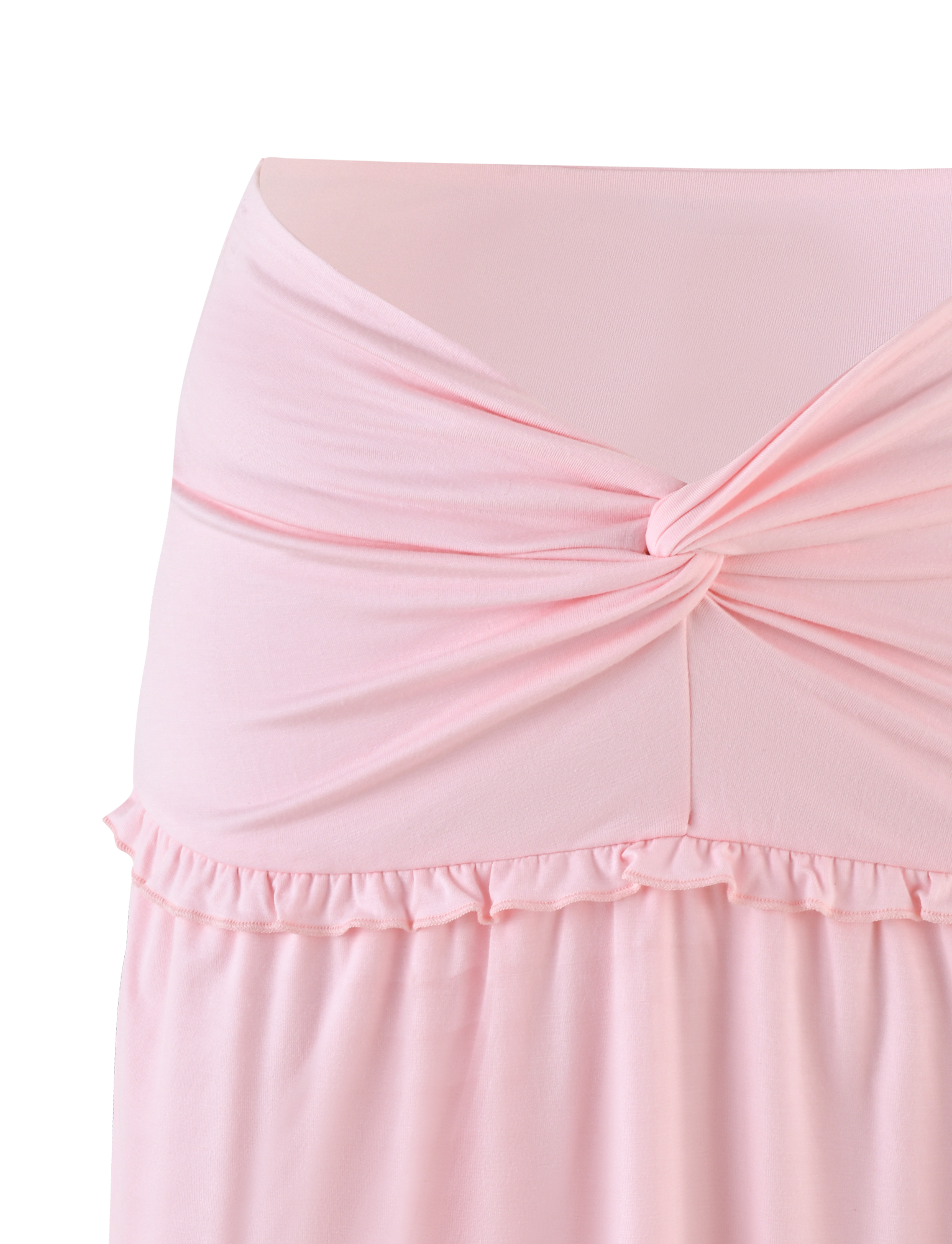 Close-up of the TIGERMIST KATYA MINI SKIRT in pale pink, featuring jersey fabric, a twisted knot at the waist, and a small ruffle trim below the waistband.