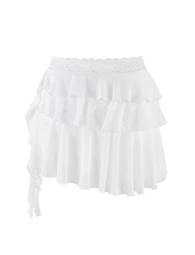 The AVALYN SKIRT by TIGERMIST is a white mini skirt featuring mesh frills, lace trim at the waistband and middle tier, soft high-stretch fabric, and an asymmetrical hem for a flowing ruffled look.