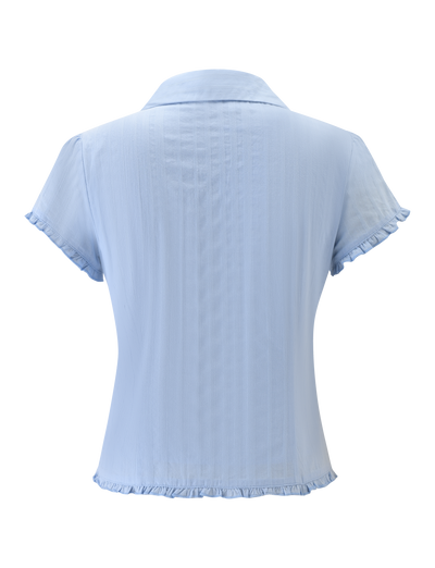 The TIGERMIST VALERIE SHORT SLEEVE SHIRT in baby blue features chic ruffles and a modern woven design, offering a stylish update to the classic short-sleeve shirt.