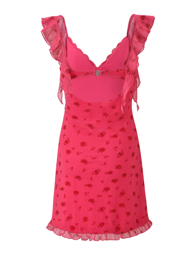 The TIGERMIST AMARIS MINI DRESS - DITSY FLORAL is a bright pink V-neck mini with ruffled straps, cut-out back, and a mesh overlay in a subtle floral print. Its fitted bodice and ruffled hem give it a playful, flared silhouette.