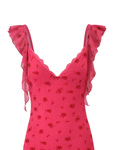 The TIGERMIST AMARIS MINI DRESS - DITSY FLORAL features a sleeveless pink V-neck design with delicate lace trim, flutter ruffle straps, and a charming red rose pattern on soft printed mesh.