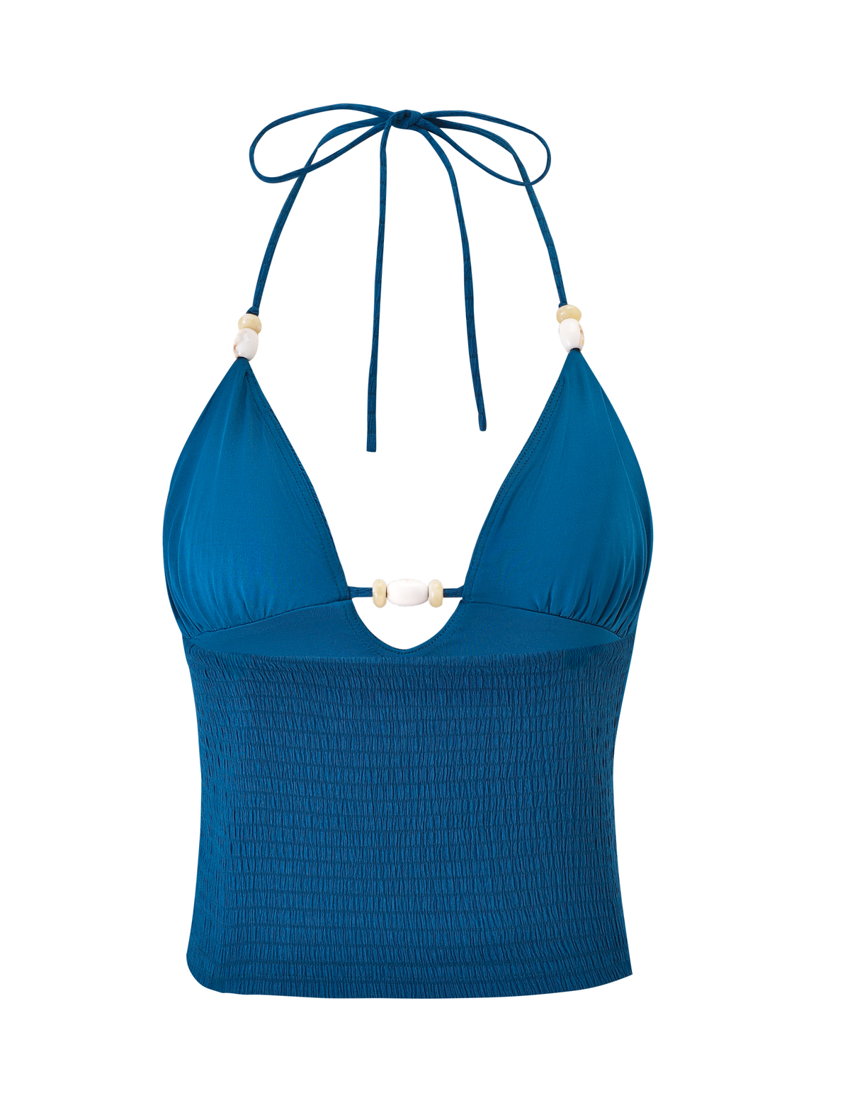 The ZINNIA TOP - BLUE by TIGERMIST is a blue halter neck crop top with a bodycon fit, shirred bodice, deep V-neckline, and white bead accents on the bust and straps.
